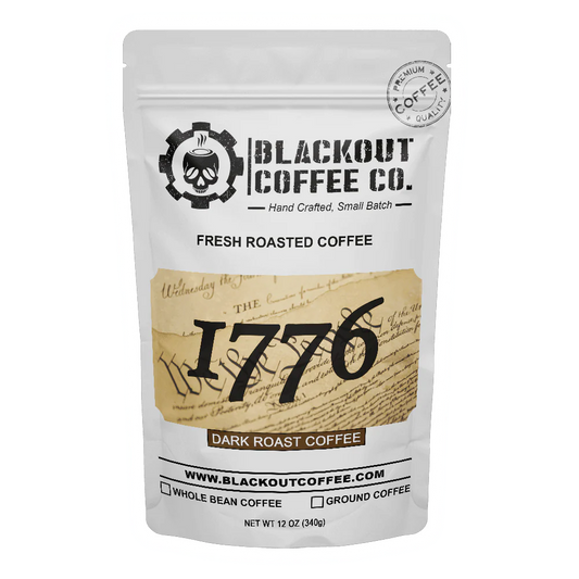 Blackout Coffee 1776 Dark Roast 12oz coffee bag on a dark surface with bold patriotic branding and American flag imagery