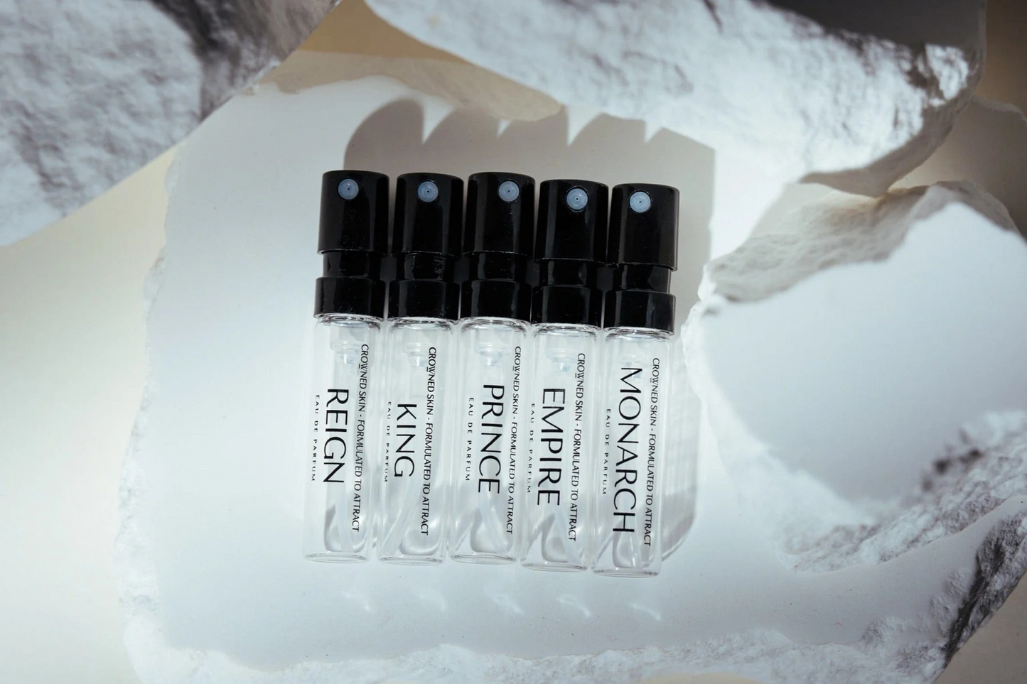 Crowned Skin Cologne Discovery Set displayed elegantly, featuring multiple premium men's fragrances in a curated gift set for men who appreciate luxury grooming.