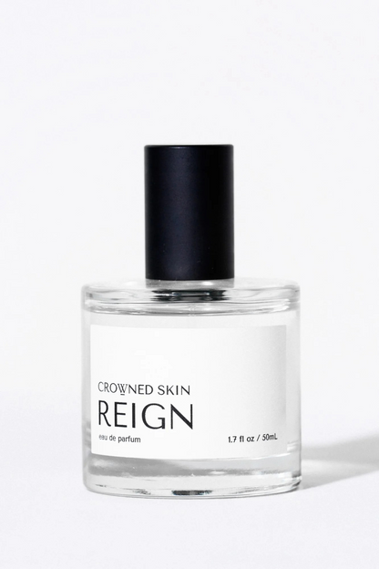 Crowned Skin Reign Eau de Parfum bottle — a fresh luxury men's fragrance featuring notes of Bergamot, Jasmine, Eucalyptus, and Amber Mist.