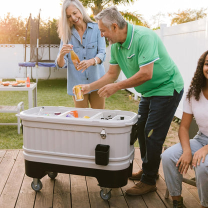 Igloo Party Bar 125 quart rolling hard cooler in gray with removable beverage tub lid, wheeled base, and stainless steel bottle opener for outdoor entertaining