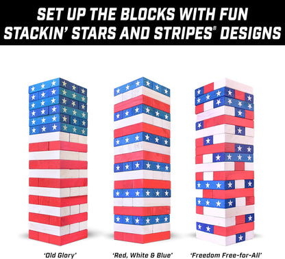 GoSports Giant Wooden Toppling Tower stacking game in Stars and Stripes edition standing over 5 feet tall outdoors at a 4th of July backyard party
