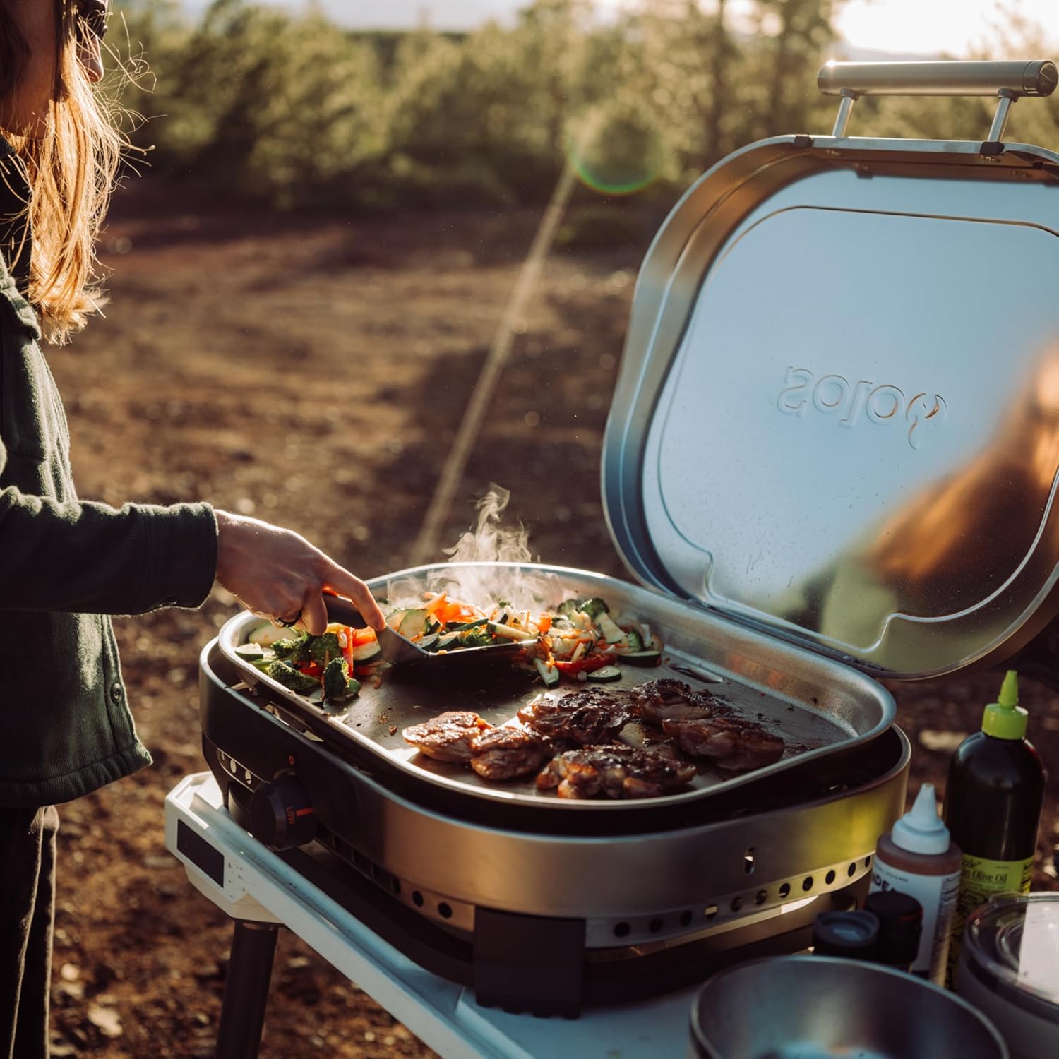 Solo Stove Steelfire 22 inch stainless steel propane griddle portable flat top outdoor grill on table