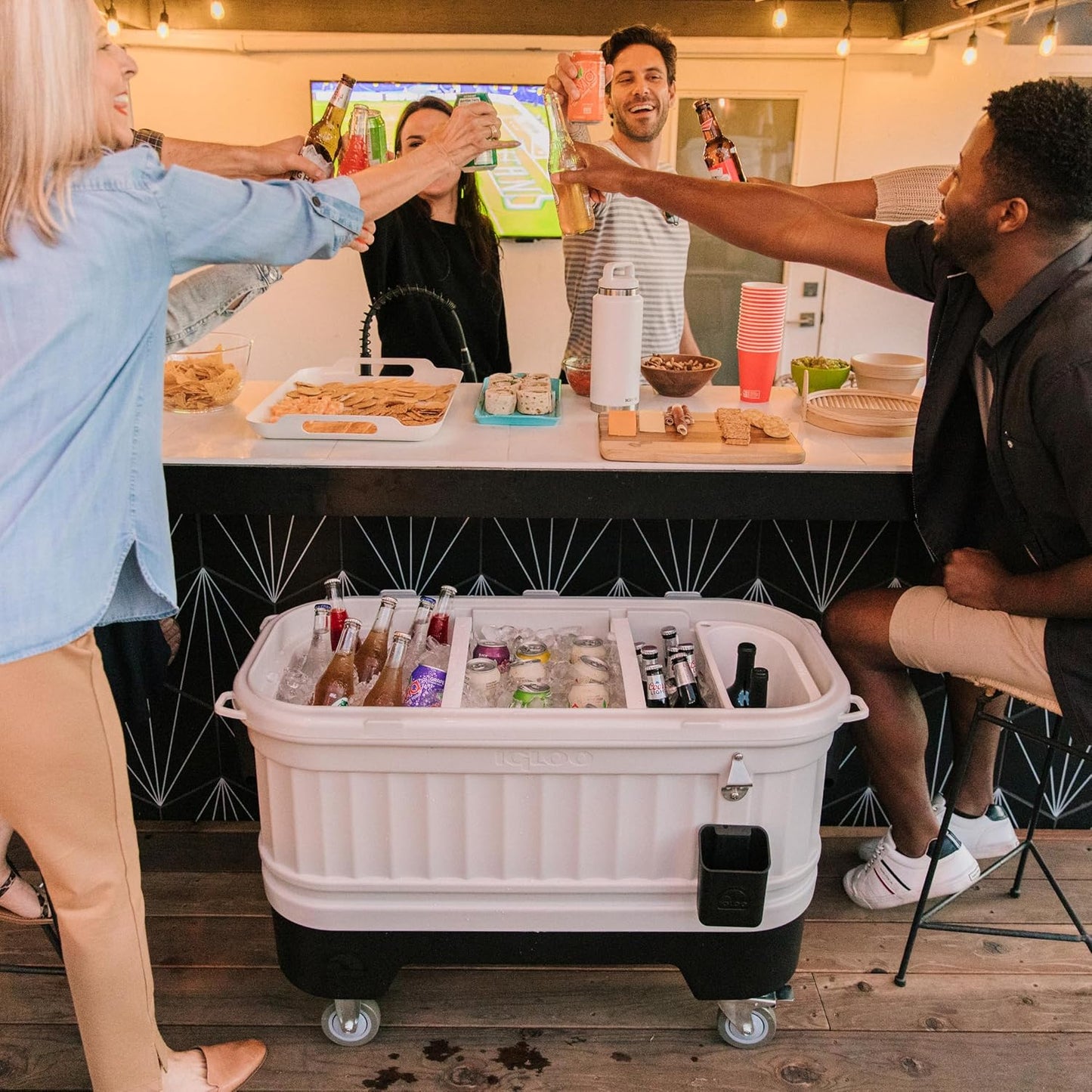Igloo Party Bar 125 quart rolling hard cooler in gray with removable beverage tub lid, wheeled base, and stainless steel bottle opener for outdoor entertaining