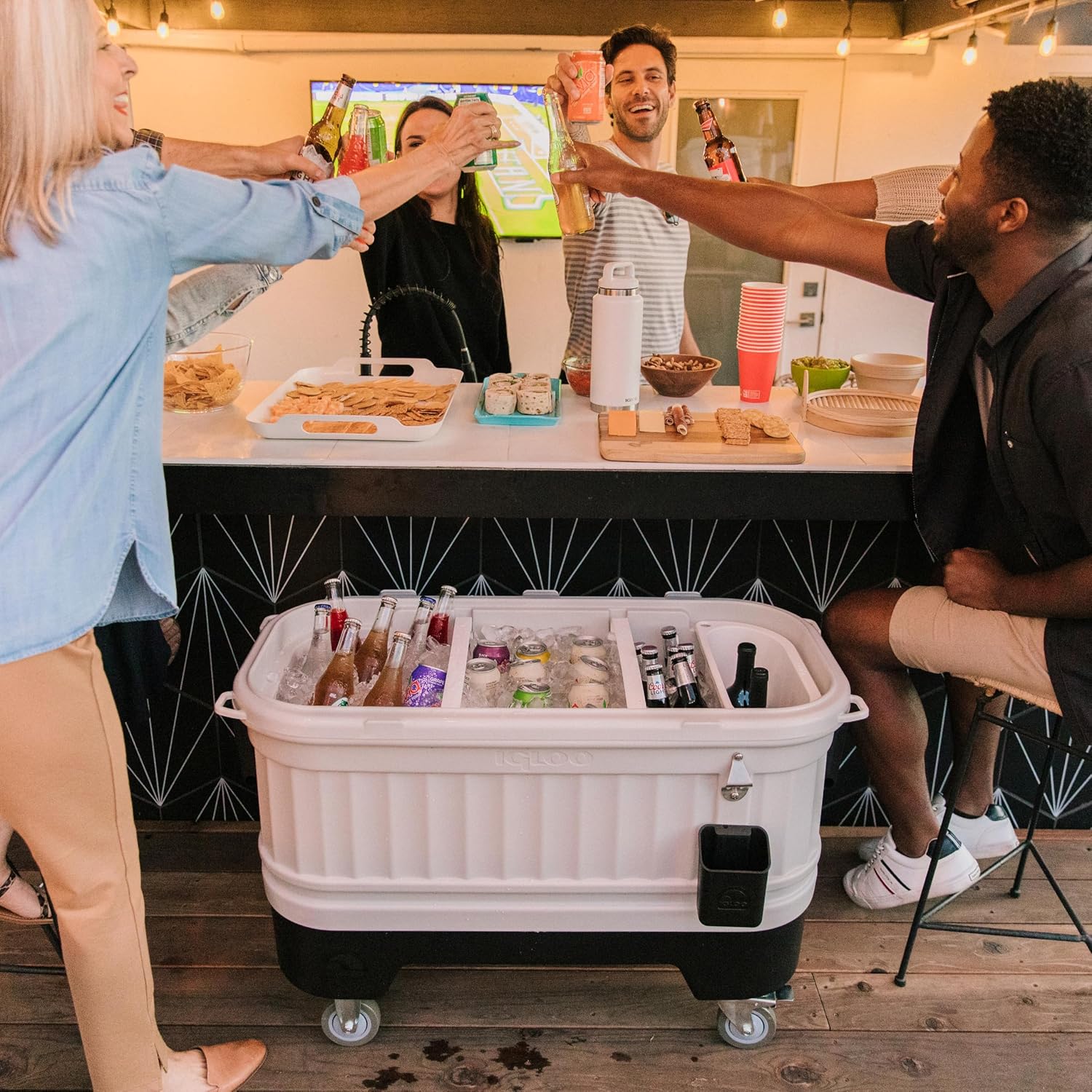Igloo Party Bar 125 quart rolling hard cooler in gray with removable beverage tub lid, wheeled base, and stainless steel bottle opener for outdoor entertaining