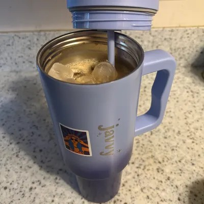 “Limited Edition Javvy Stainless Steel Tumbler 40oz with handle and splash-proof lid.”