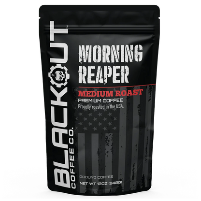 Blackout Coffee Morning Reaper 12oz coffee bag on a rugged dark surface with bold patriotic branding