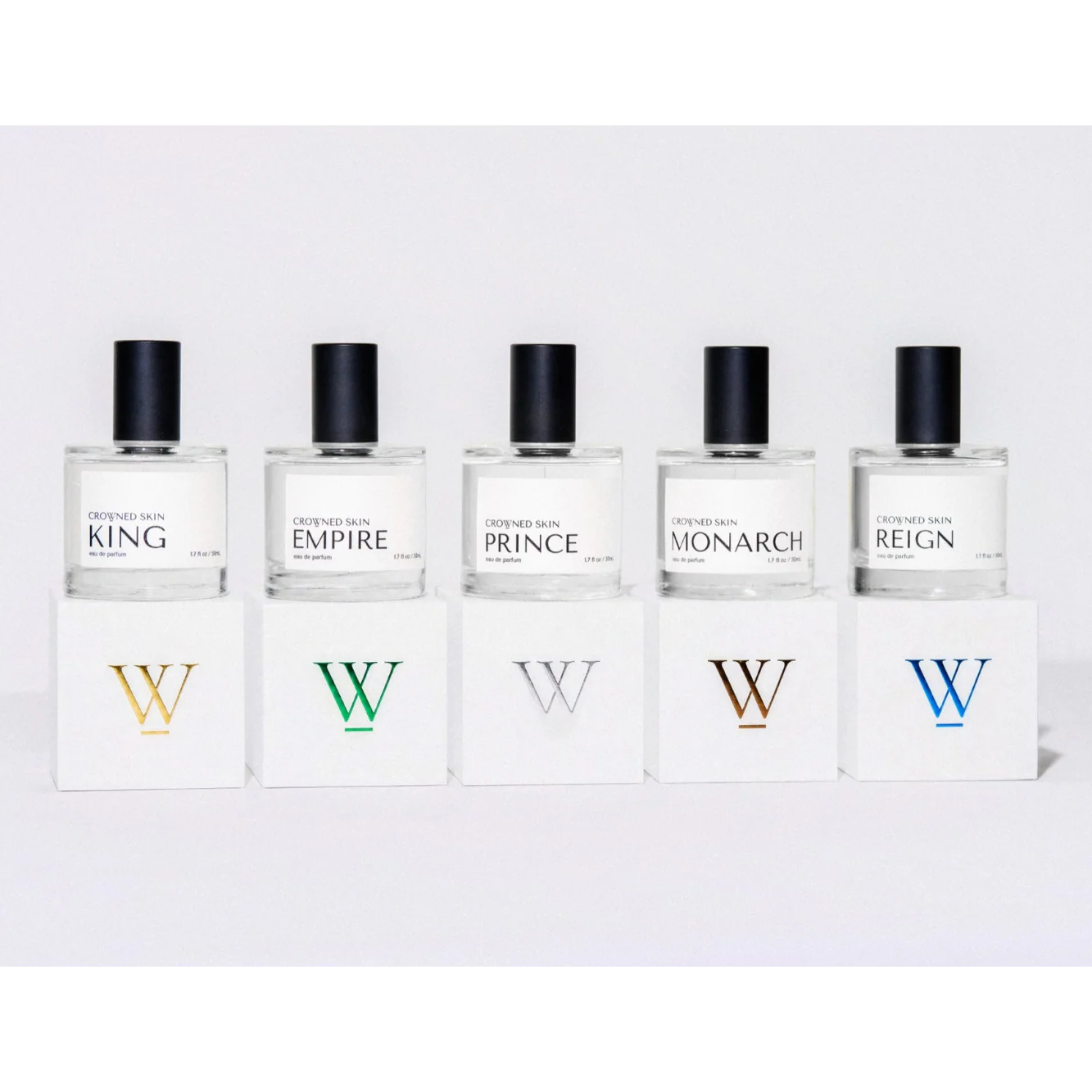 Crowned Skin King Eau de Parfum bottle displayed elegantly — a luxury men's fragrance featuring notes of Mandarin, Patchouli, Dark Vanilla, and Musk.