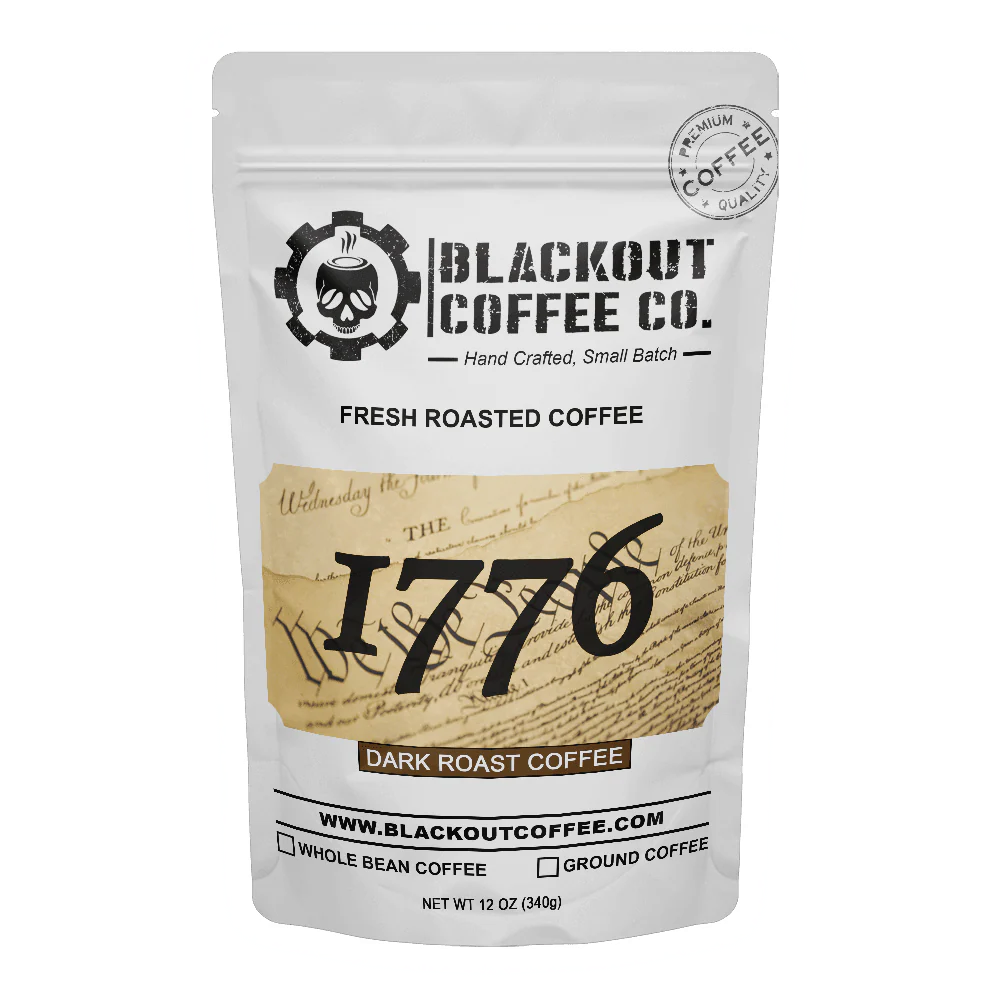 Blackout Coffee 1776 Dark Roast 12oz coffee bag on a dark surface with bold patriotic branding and American flag imagery