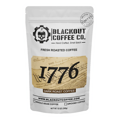Blackout Coffee 1776 Dark Roast 12oz coffee bag on a dark surface with bold patriotic branding and American flag imagery