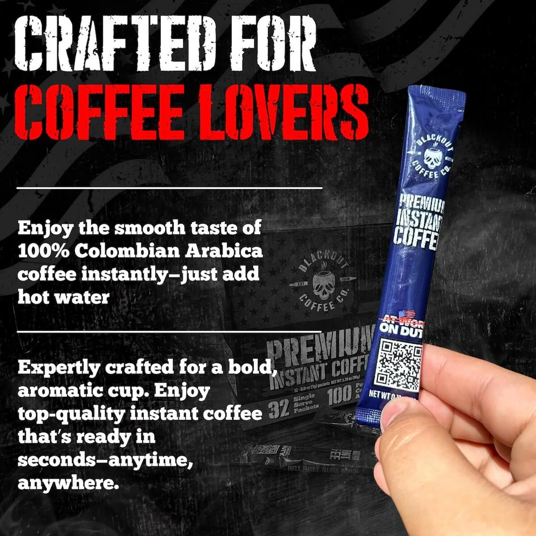 Blackout Coffee instant coffee single serve packs laid out on a rugged outdoor surface with an American flag in the background