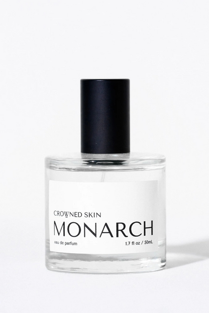 Crowned Skin Monarch Eau de Parfum bottle — a bold luxury men's fragrance featuring notes of Bergamot, Smoked Sage, Cedar, and Sandalwood.
