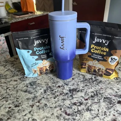 “Limited Edition Javvy Stainless Steel Tumbler 40oz with handle and splash-proof lid.”