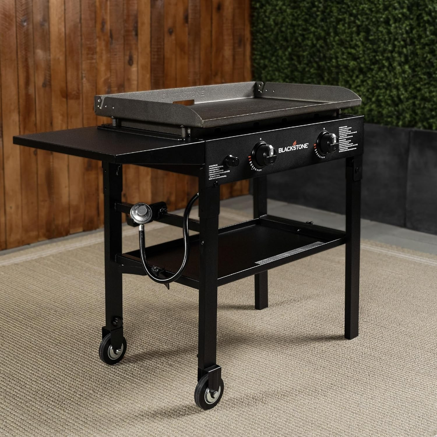 Blackstone 28-inch 2-burner propane flat top griddle station with rear grease management system outdoors — Veterans Value Hub