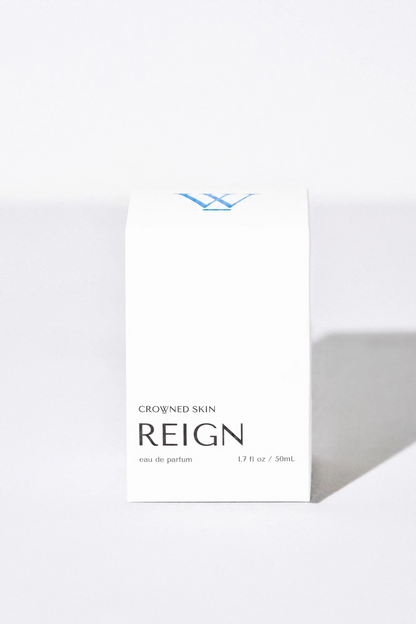 Crowned Skin Reign Eau de Parfum bottle — a fresh luxury men's fragrance featuring notes of Bergamot, Jasmine, Eucalyptus, and Amber Mist.