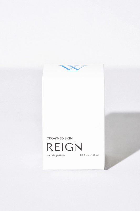 Crowned Skin Reign Eau de Parfum bottle — a fresh luxury men's fragrance featuring notes of Bergamot, Jasmine, Eucalyptus, and Amber Mist.
