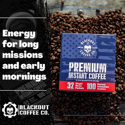 Blackout Coffee instant coffee single serve packs laid out on a rugged outdoor surface with an American flag in the background
